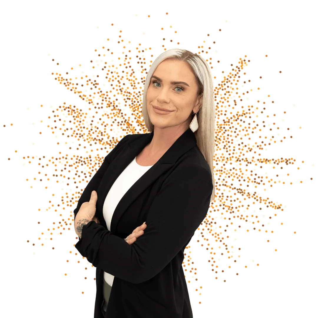 Professional Beauty Consultant Confident professional woman smiling with arms crossed in front of a festive background.